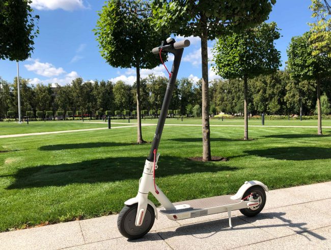 White Xiaomi M360 Scooter with a background of the park in Vilnius